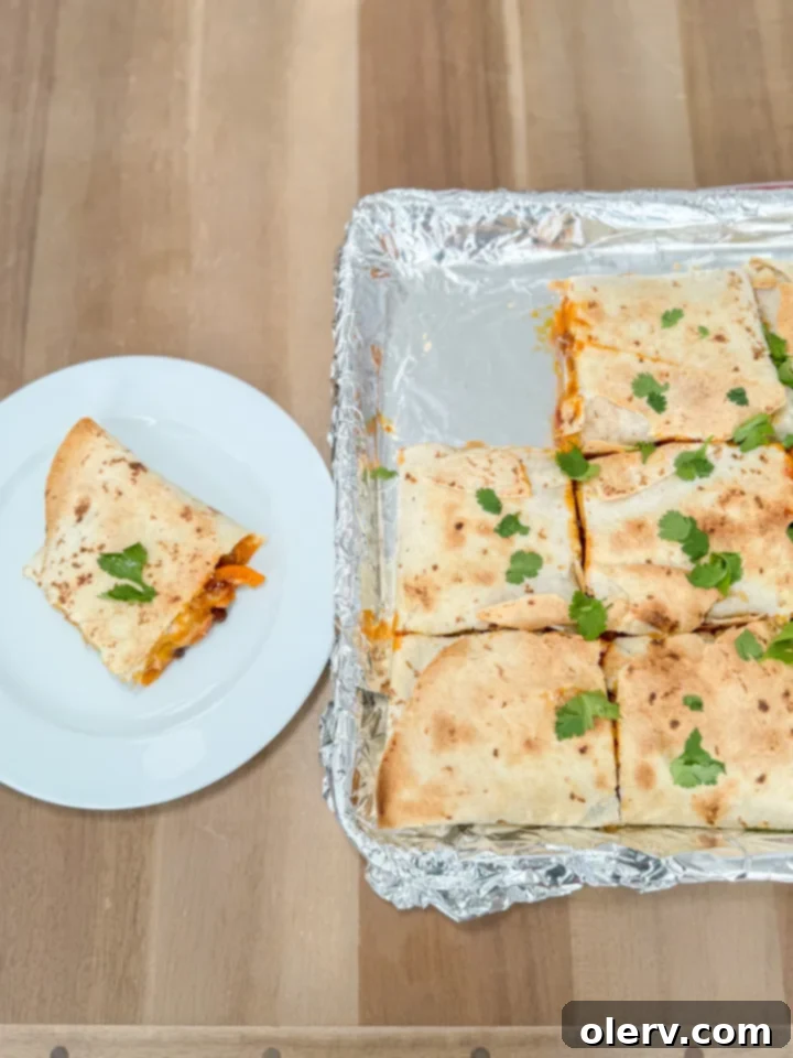Effortless Oven Quesadillas 4 Cooked fajita vegetables on a sheet pan