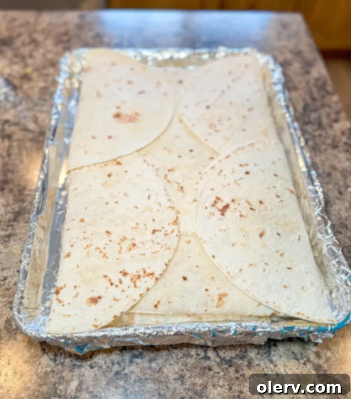 Effortless Oven Quesadillas 7 Folded sheet pan quesadilla before baking