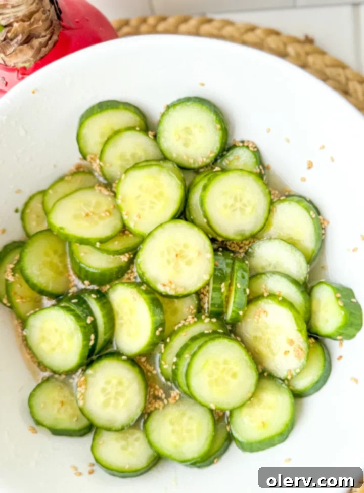 Pinterest graphic for Asian Cucumber Salad recipe, '15-minute Asian Cucumber Salad.'