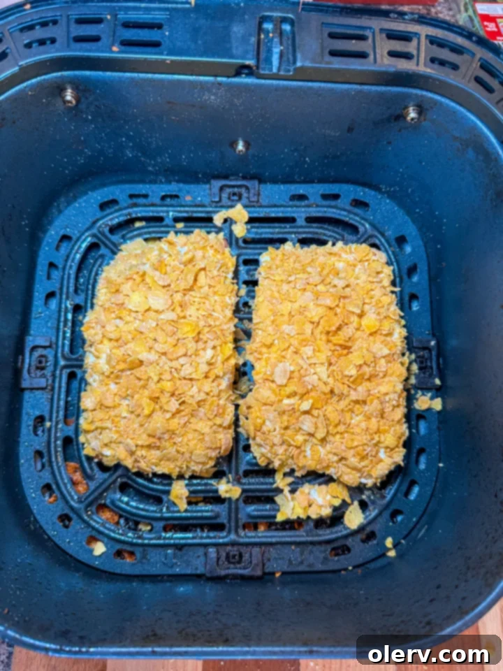 Lemon-Kissed Crispy Salmon Delight 5 Hands spreading mayonnaise on salmon fillets