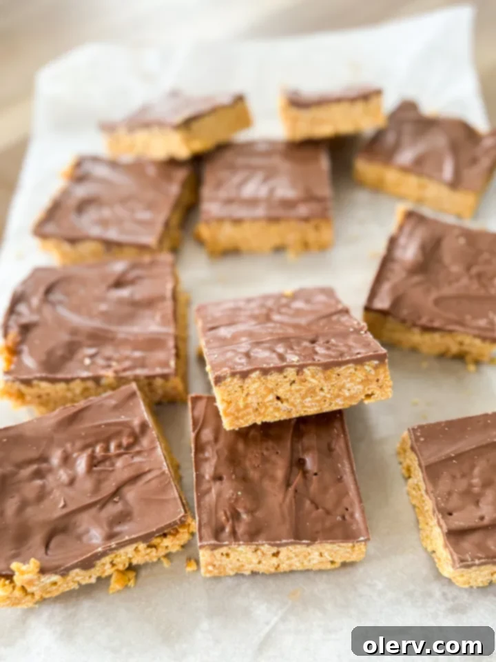 Irresistible No-Bake Scotcheroo Bars 6 A single Scotcheroo bar, perfectly cut and ready to be enjoyed, showing its layers.