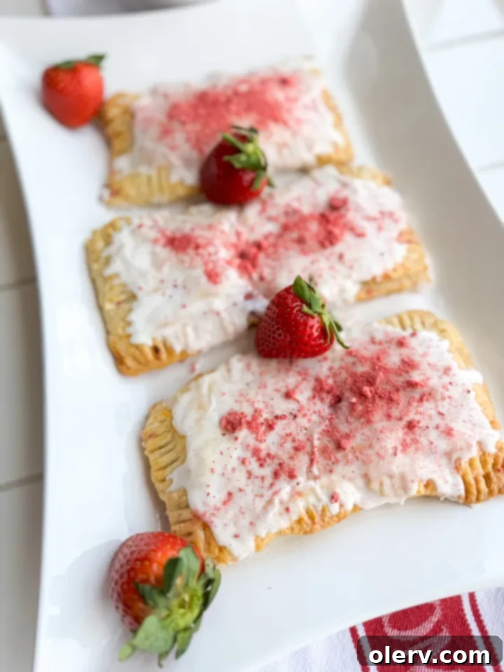 Frosted Strawberry Bliss 4 The process of making homemade Poptart crust, showing raw dough ready to be rolled out.
