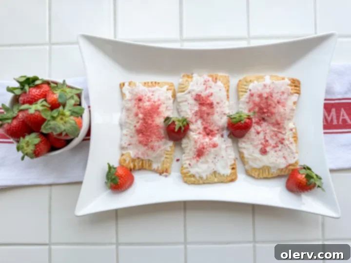 Frosted Strawberry Bliss 7 A tray of beautifully baked homemade strawberry Poptarts, ready to be iced and enjoyed.
