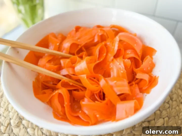 Fresh Carrot Slaw 4 Ingredients for Ginger Sesame Dressing on a countertop