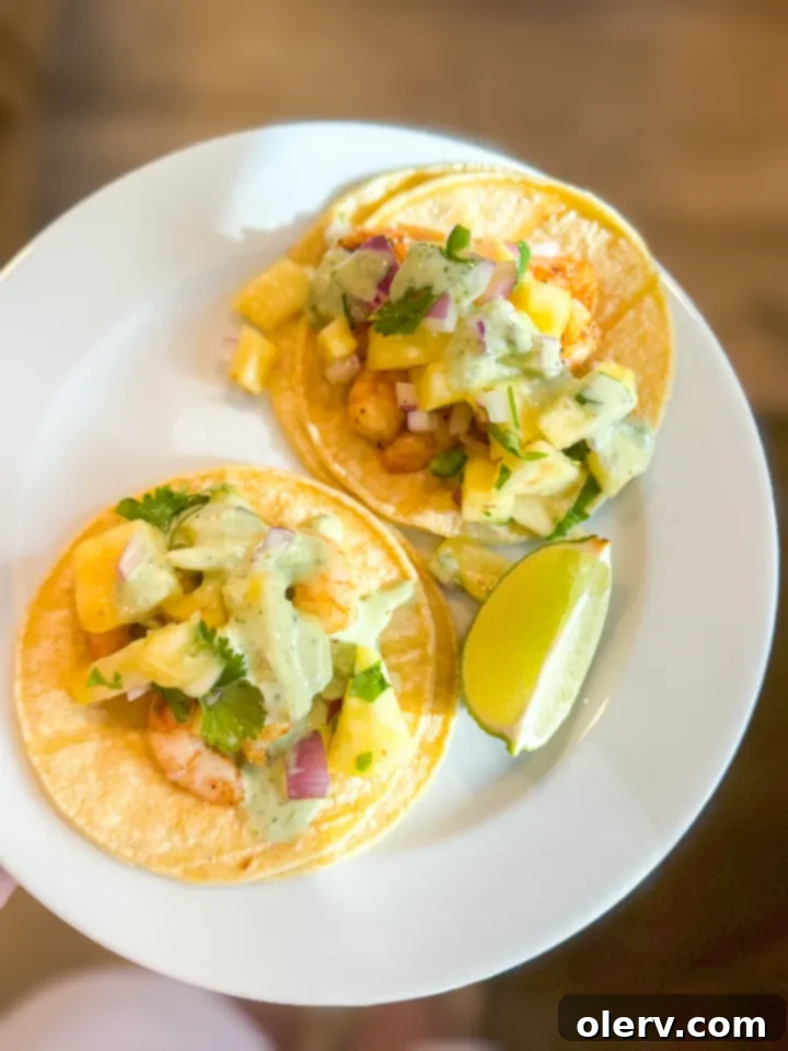 Crispy Air Fryer Shrimp Tacos 4 Assortment of fresh ingredients for shrimp tacos and pineapple salsa on a kitchen counter