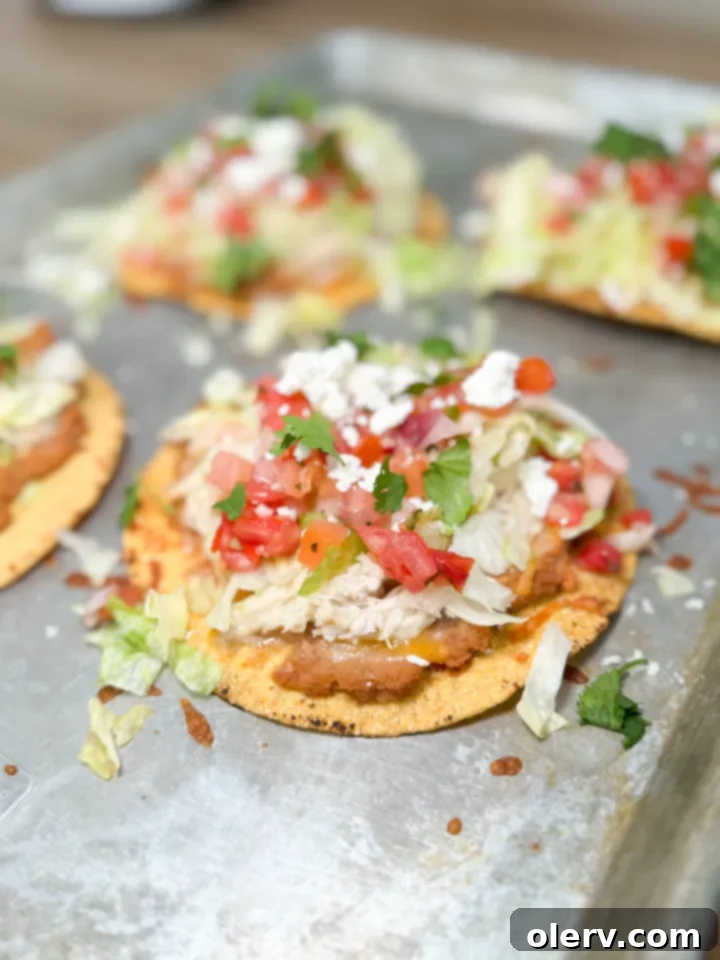 Crispy Chicken Tostadas 5 Prepared shredded chicken mixed with taco seasoning, ready for tostada assembly.