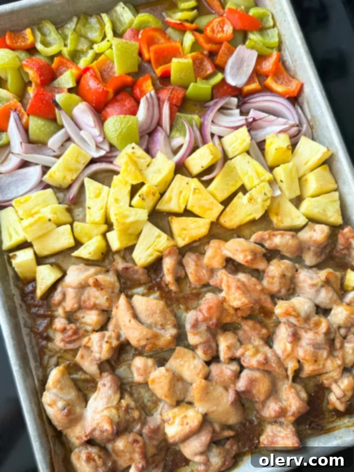 Aloha Chicken 6 A serving of Sheet Pan Hawaiian Chicken with coconut rice in a bowl.
