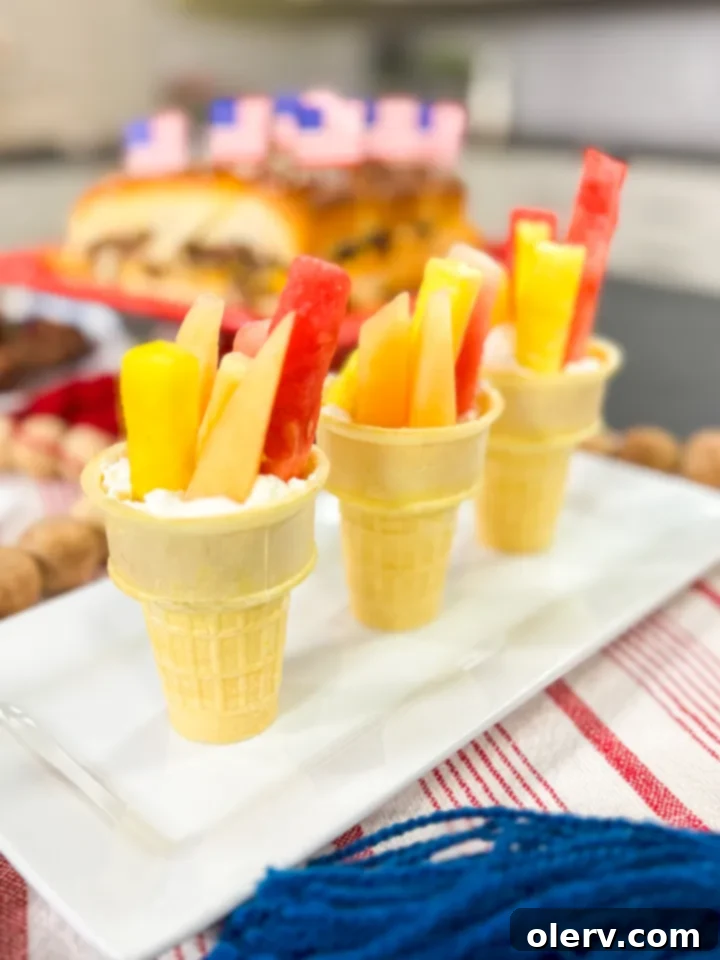 4 Winning Olympic Party Bites 6 A creative display of Easy Fruit Torches with a creamy dip, perfect for an Olympic party.