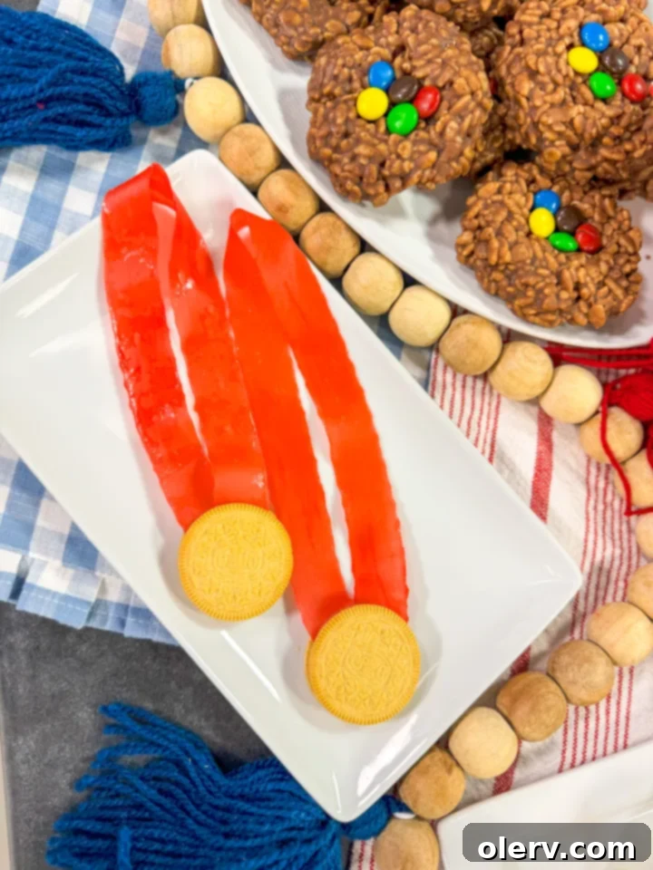 4 Winning Olympic Party Bites 7 Two edible gold medals, made from golden Oreos and fruit by the foot, tied with red ribbons.