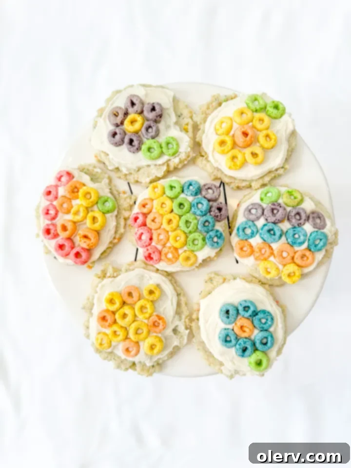 Retro Rainbow Sugar Cookies 2 Freshly baked Rainbow Soda Shop Sugar Cookies with Fruit Loops and creamy frosting on a cooling rack