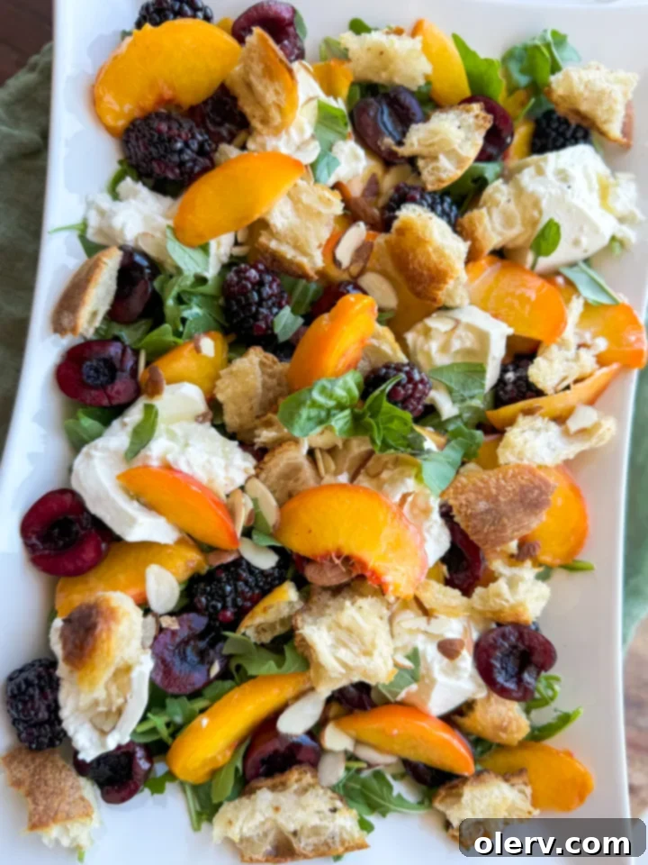 Sun-Kissed Peach & Burrata Delight 6 A top-down view of the assembled summer peach and burrata salad, garnished with basil and ready to be served, highlighting its fresh appeal.