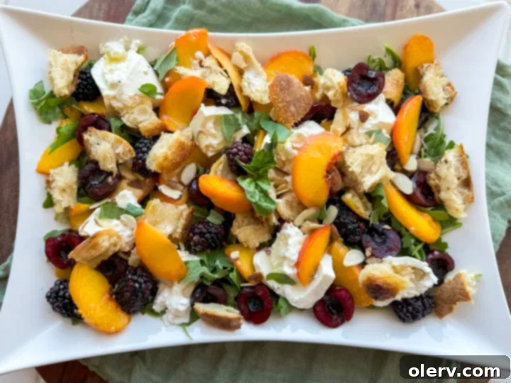 Sun-Kissed Peach & Burrata Delight 7 A vibrant and fresh summer salad with peaches, creamy burrata, and berries in a white rustic bowl, ready to be enjoyed.