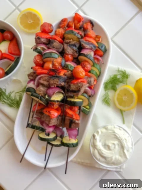 Mediterranean Beef Skewers with Creamy Tzatziki 2 Platter of perfectly grilled beef skewers with a side of Tzatziki sauce