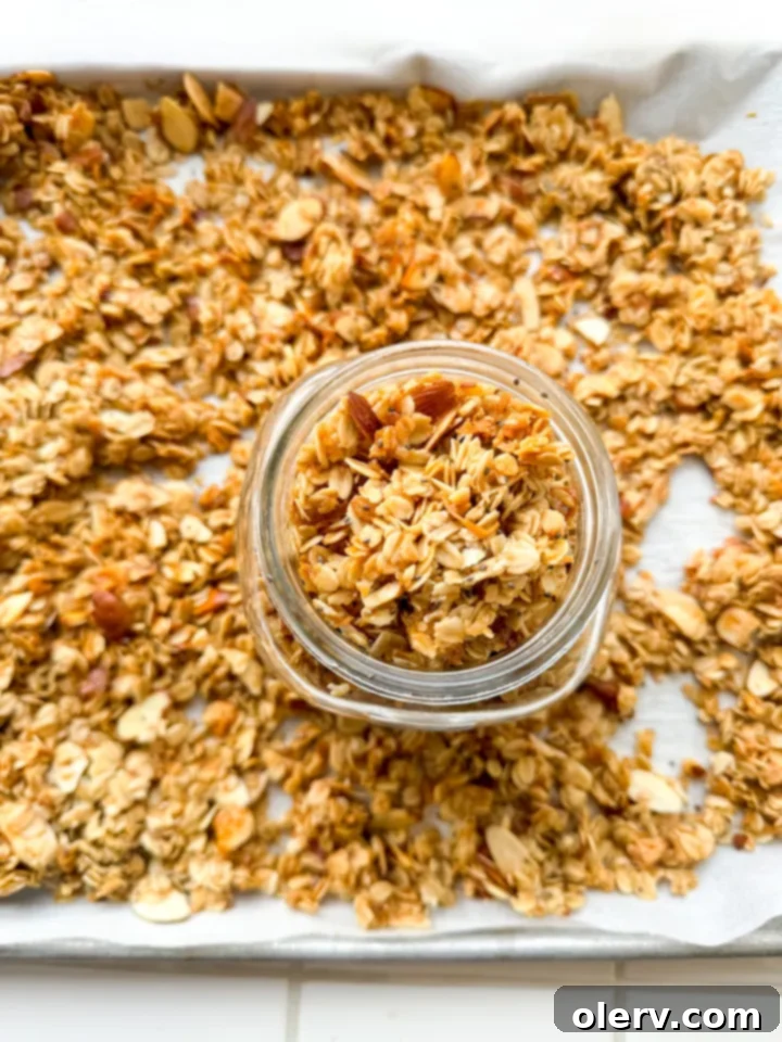 Whip Up Your Own Granola 4 Ingredients for homemade granola laid out on a wooden surface: oats, nuts, coconut flakes, chia seeds, maple syrup, coconut oil, and vanilla extract.