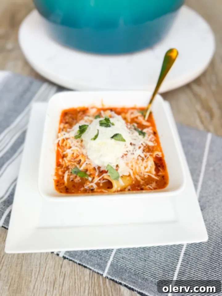 Ultimate Lasagna Soup 3 Close-up of hearty lasagna soup with noodles, meat, and rich tomato broth