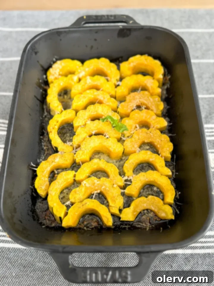 Golden Parmesan Delicata Roast 4 Preparing delicata squash slices with minced garlic and melted butter.