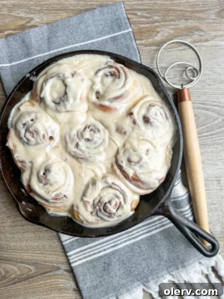 Golden Hour Cinnamon Rolls 2 Freshly baked homemade one-hour cinnamon rolls with white frosting in a baking dish