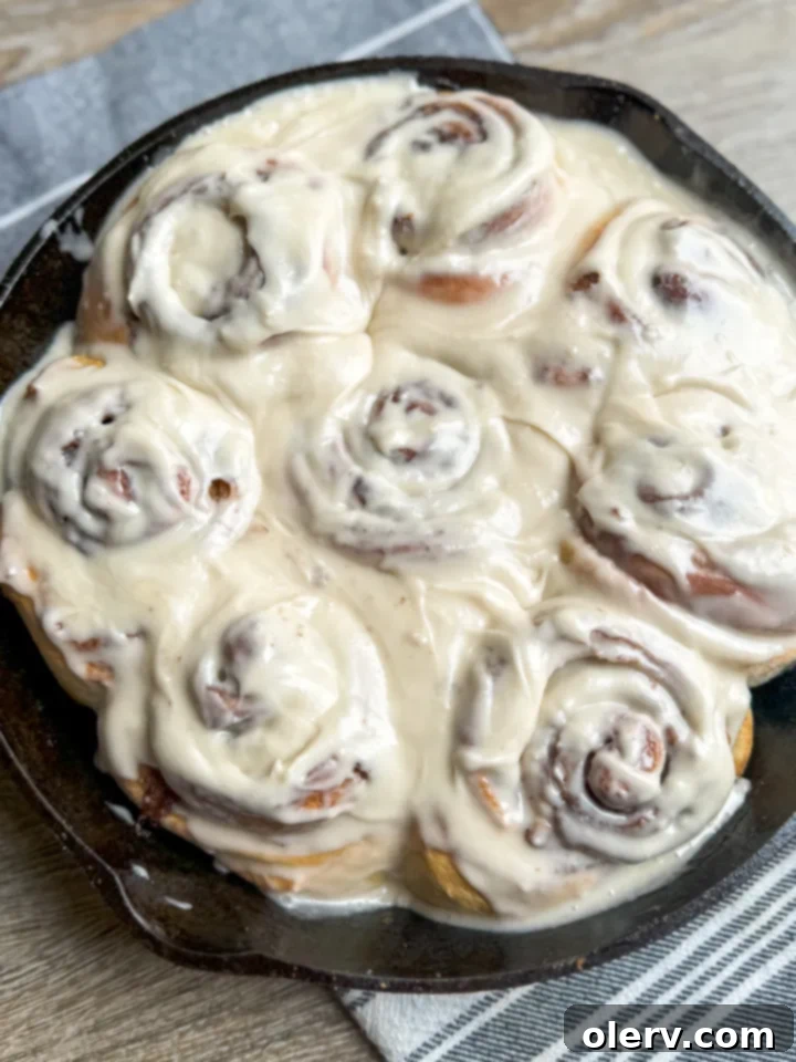 Freshly baked homemade one-hour cinnamon rolls with white frosting