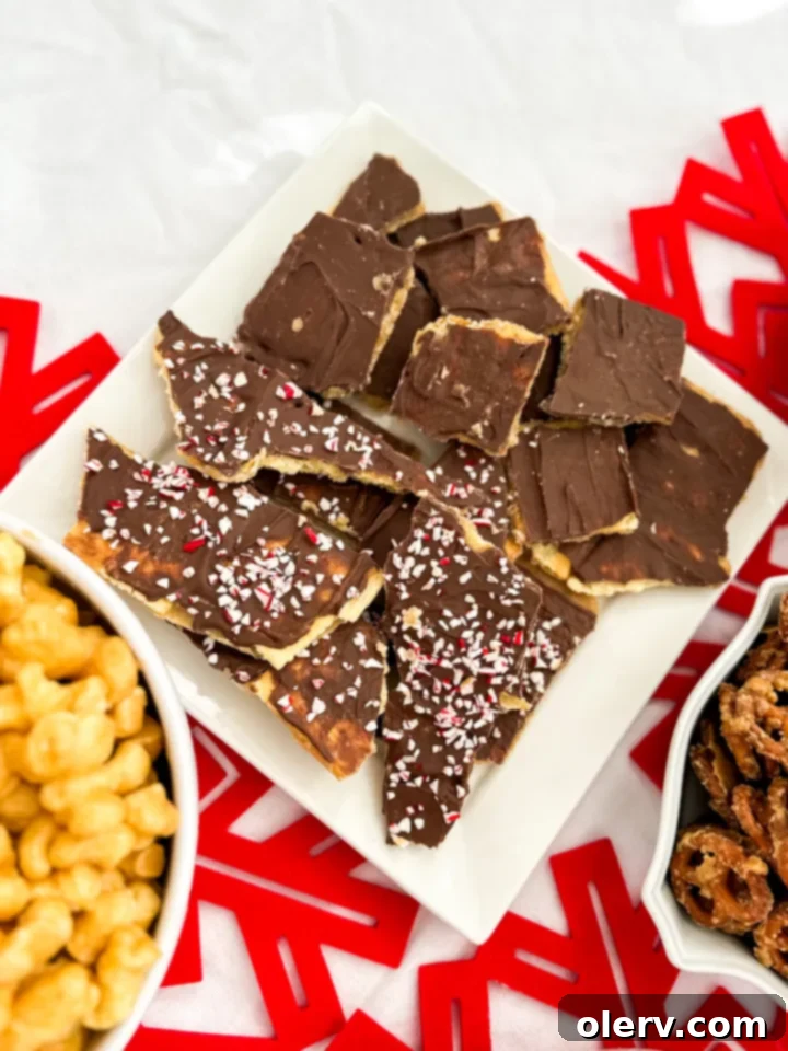 Irresistible Holiday Candy Bark 4 A baking sheet filled with a single layer of saltine crackers, ready for the caramel and chocolate treatment.
