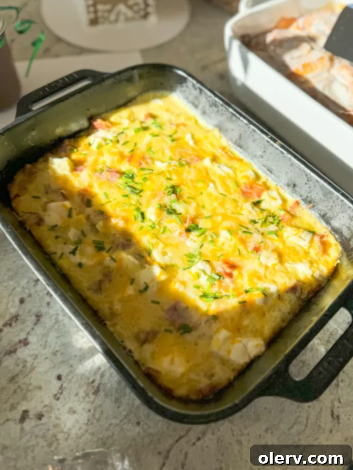 Close-up of a bowl filled with mixed ingredients for the overnight breakfast casserole