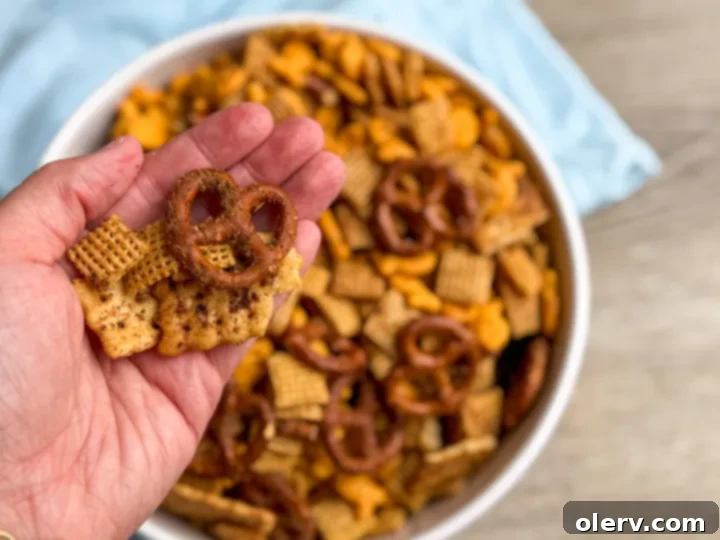Ranch Chex Mix spread out on a baking sheet, freshly baked and golden brown.