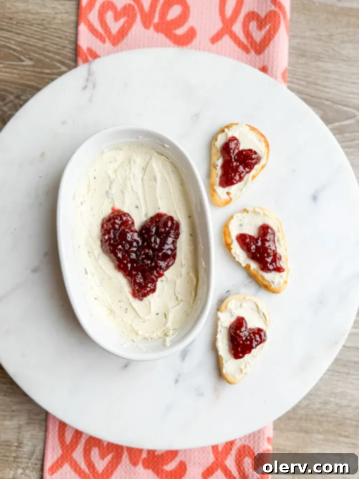 Girl Dinner Perfected 6 Appetizing Sweet Kiss Bread Bites made with Naan, Boursin cheese, raspberry jam, and a drizzle of hot honey.