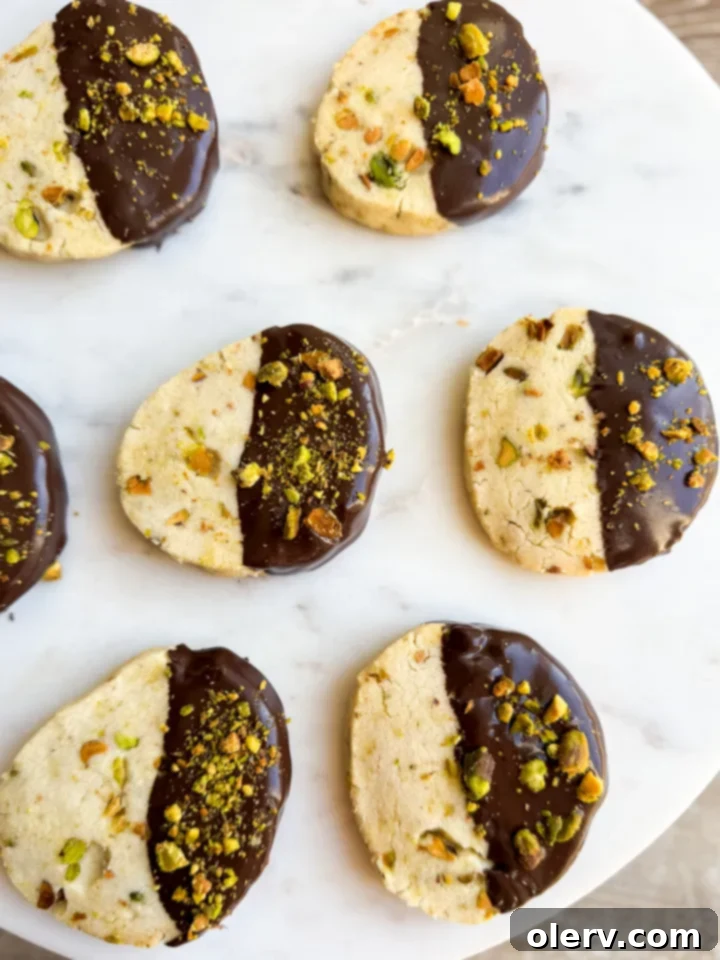 Buttery Pistachio Shortbread Cookies 2 Delicious pistachio shortbread cookies dipped in chocolate and topped with chopped pistachios.