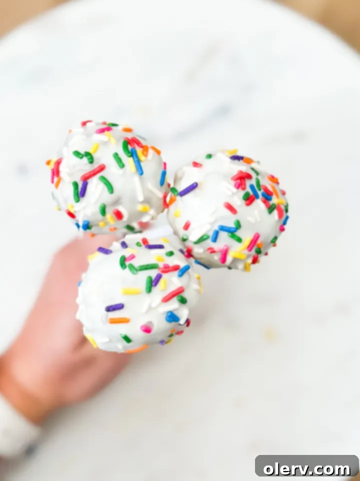 Easy Cake Pops finished with white chocolate and sprinkles