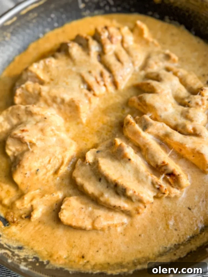 Effortless Skillet Chicken 4 Seasoned chicken breasts ready to be cooked in a skillet.