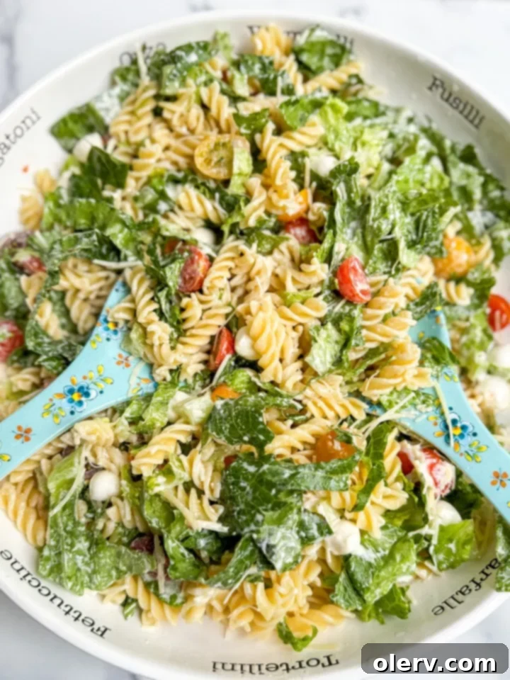 Creamy Caesar Pasta Delight 4 Cooked pasta being tossed with lemon juice