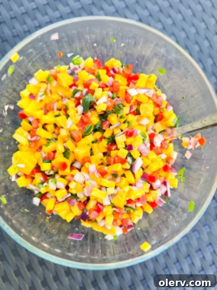Vibrant bowl of fresh mango salsa with tortilla chips