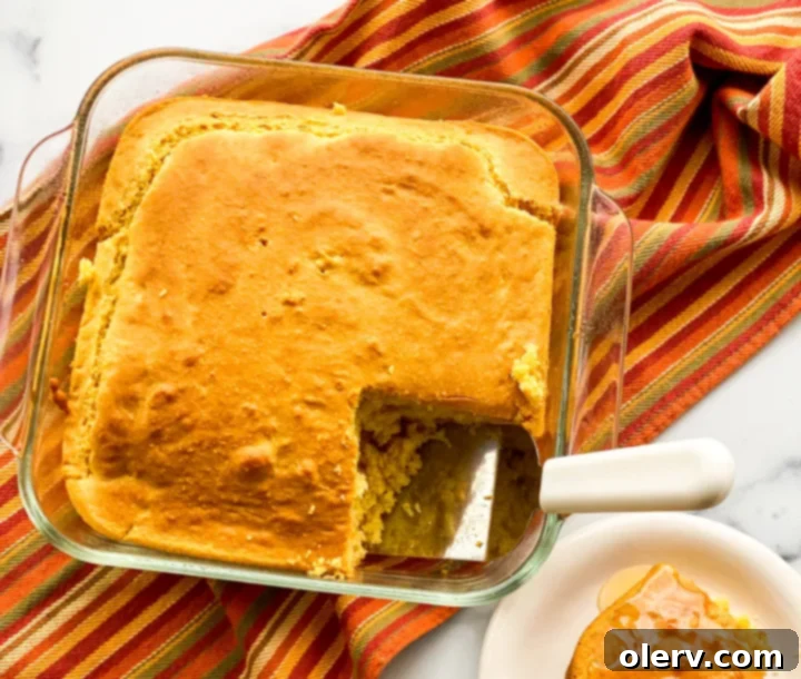 The Ultimate Cornbread 4 Dry ingredients for cornbread in a mixing bowl: cornmeal, flour, sugar, baking powder, salt, baking soda
