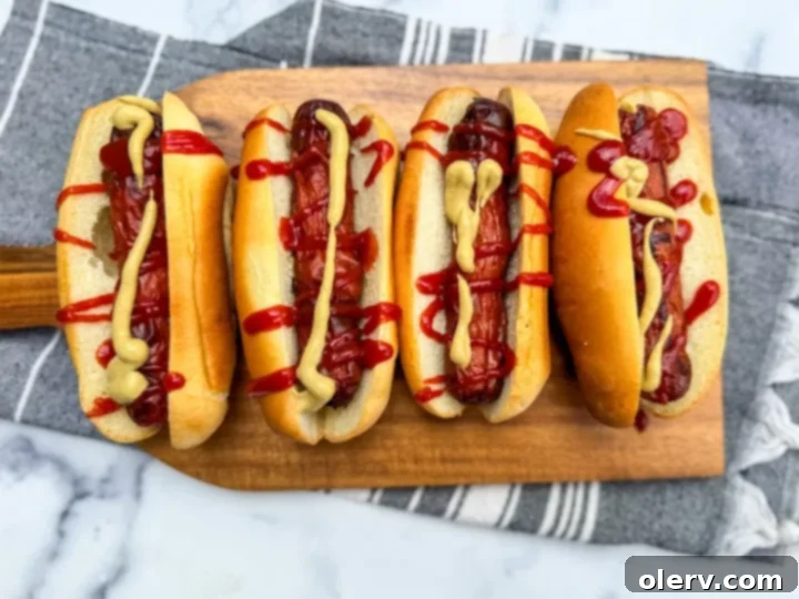 Crispy Air Fryer Hot Dogs 5 A collage of air fryer hot dog images, encouraging pinning to Pinterest.