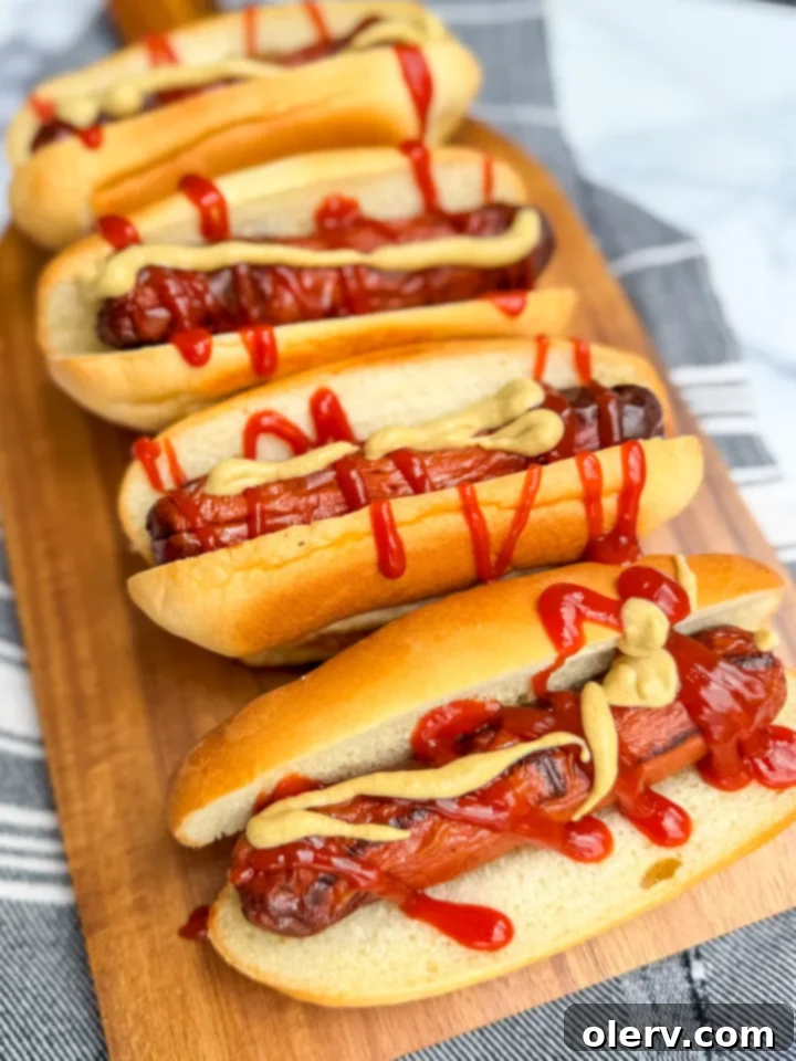Crispy Air Fryer Hot Dogs 6 Crispy Air Fryer Hot Dogs in a bun with toppings.