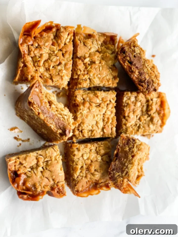 Unforgettable Carmelita Bars 6 A baking pan filled with the bottom oat crust of Carmelitas, ready for the caramel and chocolate layers.
