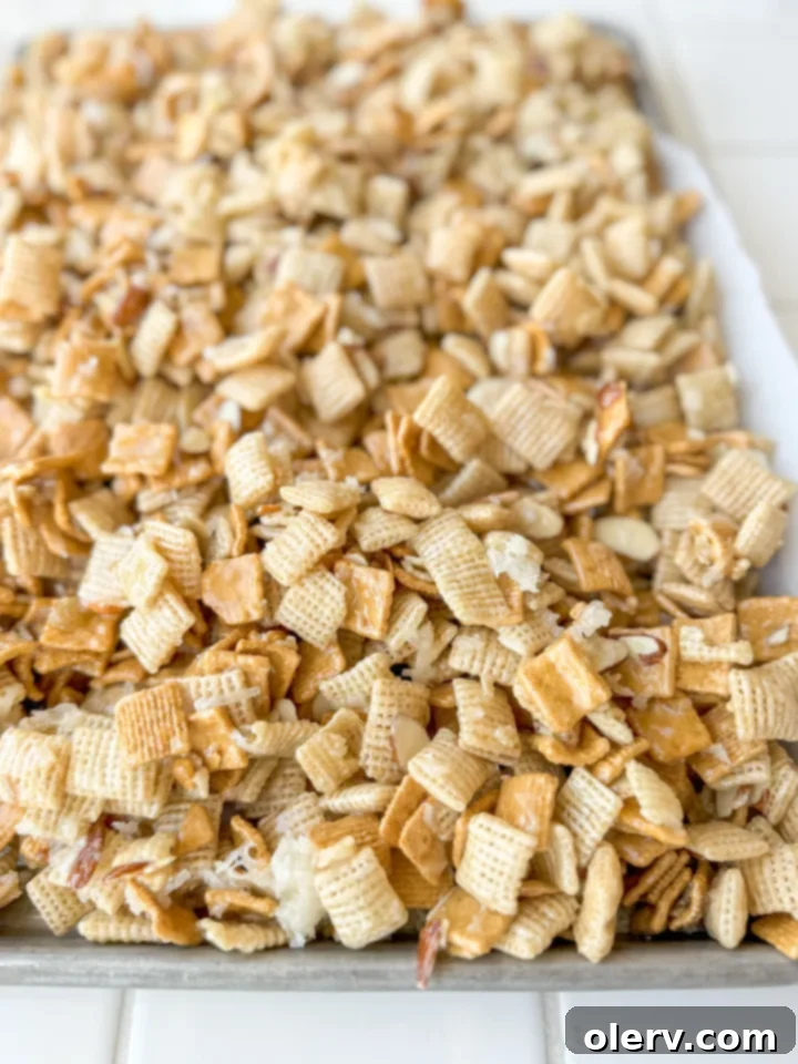 Another view of 'The Good Stuff' sweet Chex mix, highlighting its golden, coated texture.