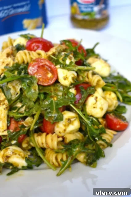 Summer Caprese Pasta 4 Barilla Basil Pesto Sauce jar on a wooden surface