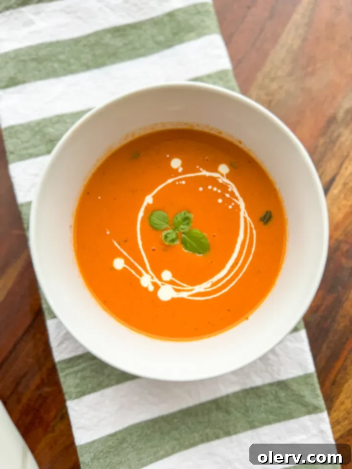 A final bowl of creamy tomato basil soup, ready to be pinned.