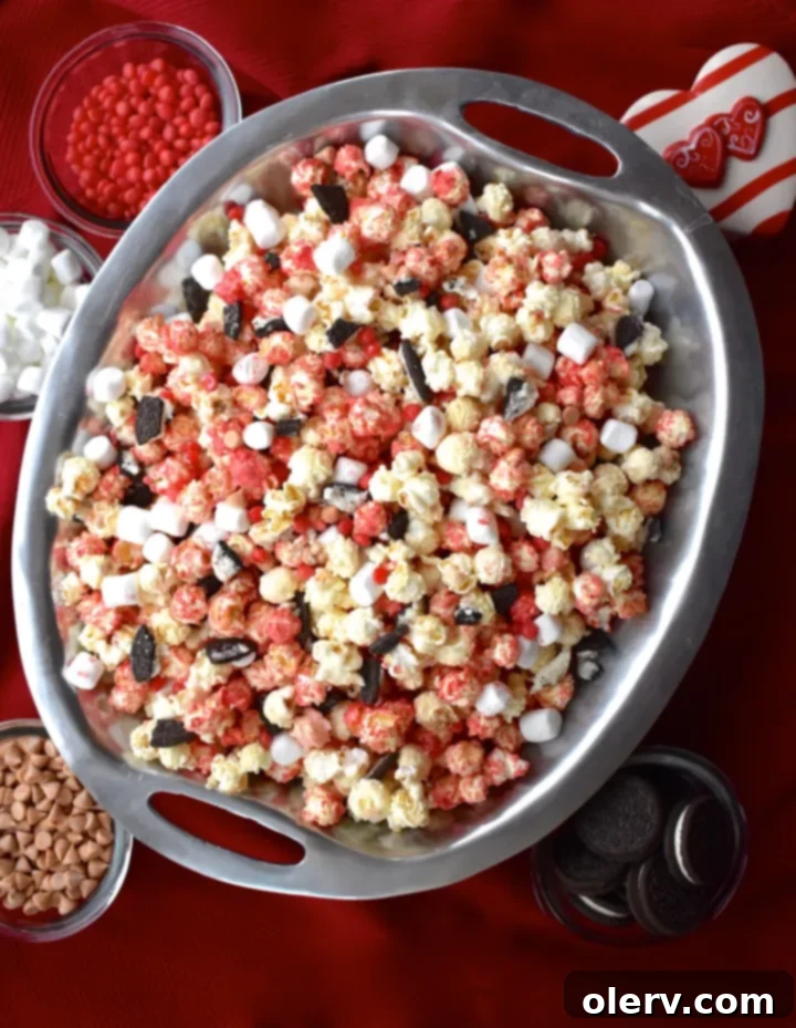 Close-up of Cupid's Crunch White Chocolate Popcorn on a serving platter, highlighting its colorful details