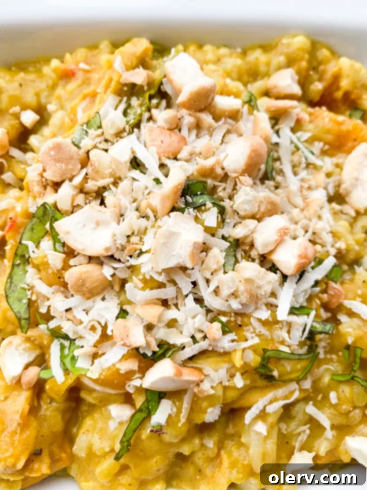 Creamy Instant Pot Coconut Curry Chicken 6 A serving of Instant Pot Coconut Curry Chicken, garnished and ready to eat.