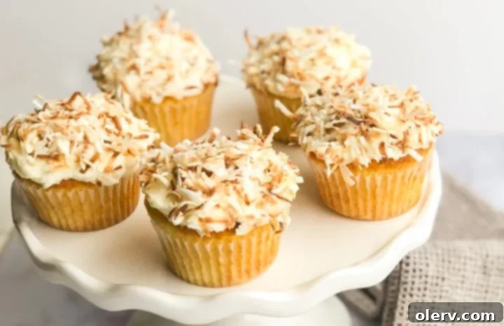 Triple Coconut Dream Cupcakes 2 Delicious Triple Coconut Cupcakes topped with toasted coconut