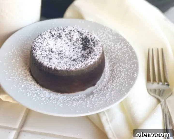 Velvet Chocolate Core Delight 2 Four perfectly baked molten chocolate lava cakes in ramekins, ready to be inverted.