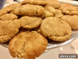 Golden Caramel Snickerdoodle Secrets 5 Platter of freshly baked Brown Butter Caramel Stuffed Snickerdoodles, ready for serving.