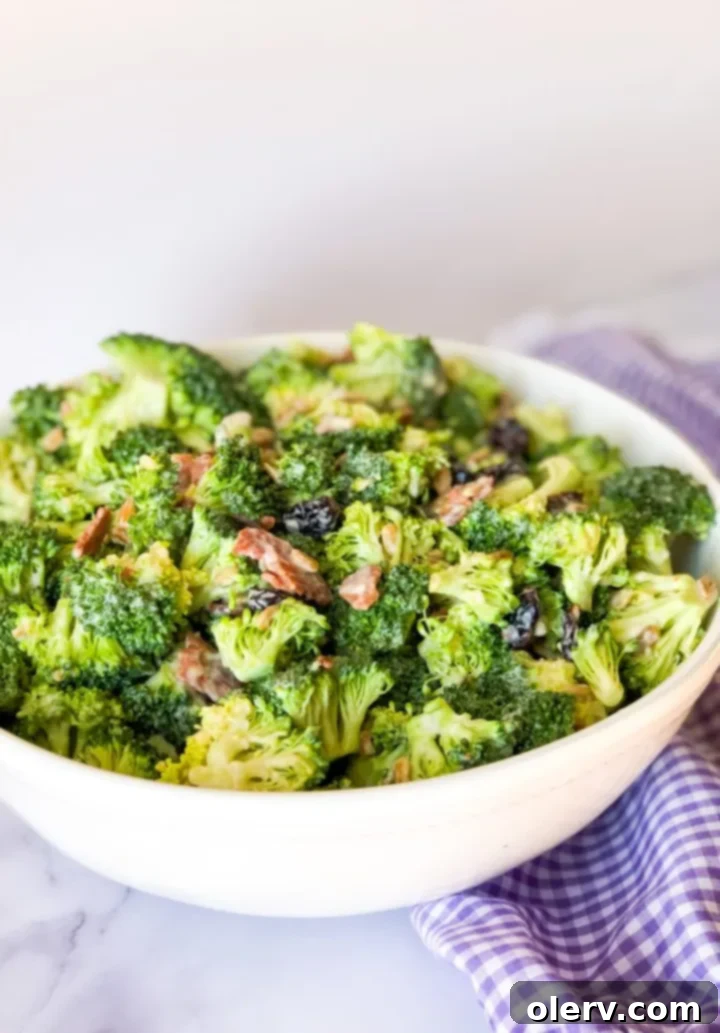Simple and Delicious Broccoli Salad 5 A bowl of fresh broccoli florets, chopped and ready for the salad.