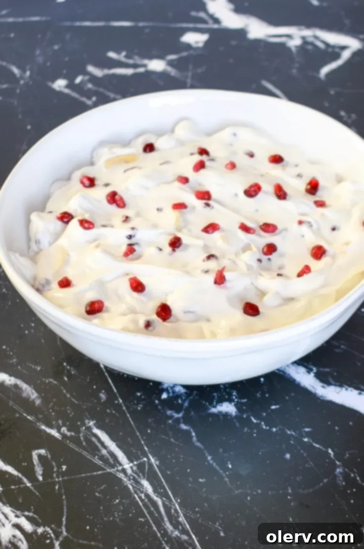 Pomegranate Banana Delight 3 Close-up of Pomegranate Banana Fruit Salad in a serving bowl