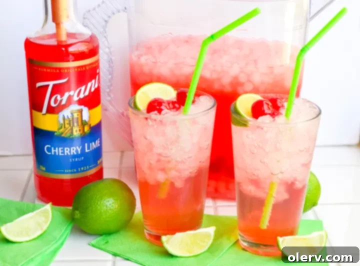 Crimson Zest Sparkle 4 Pitcher and glasses filled with homemade Sparkling Cherry Limeade for a tailgate party