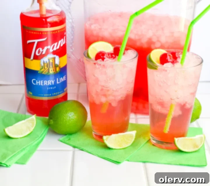 Crimson Zest Sparkle 8 Ingredients laid out for making Sparkling Cherry Limeade including Sprite, lime concentrate, Torani syrup, and cherries