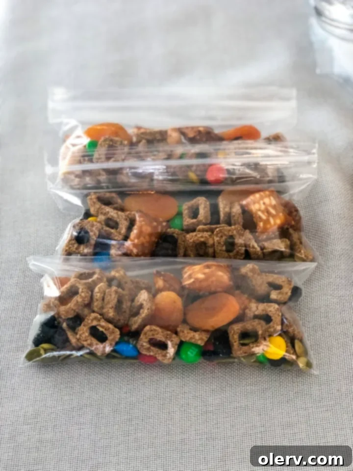 Craft Your Own Trail Mix 6 A mix of various dried fruits and nuts, forming a colorful trail mix
