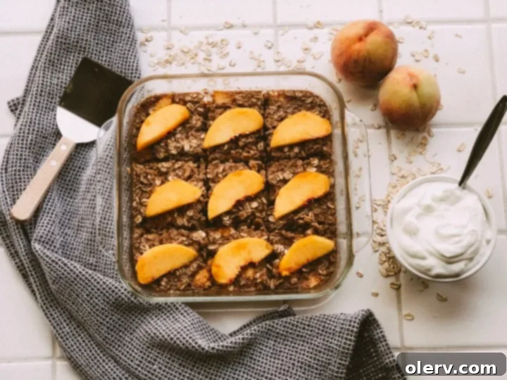 Sweet Peach Baked Oatmeal 2 Freshly baked peach oatmeal in a baking dish, ready to be served