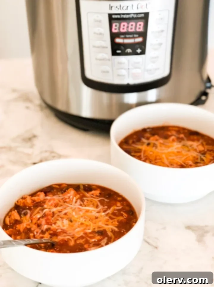 Hearty, Healthy Turkey Chili 4 The blogger looking active and comfortable in Kiava clothing while preparing food.